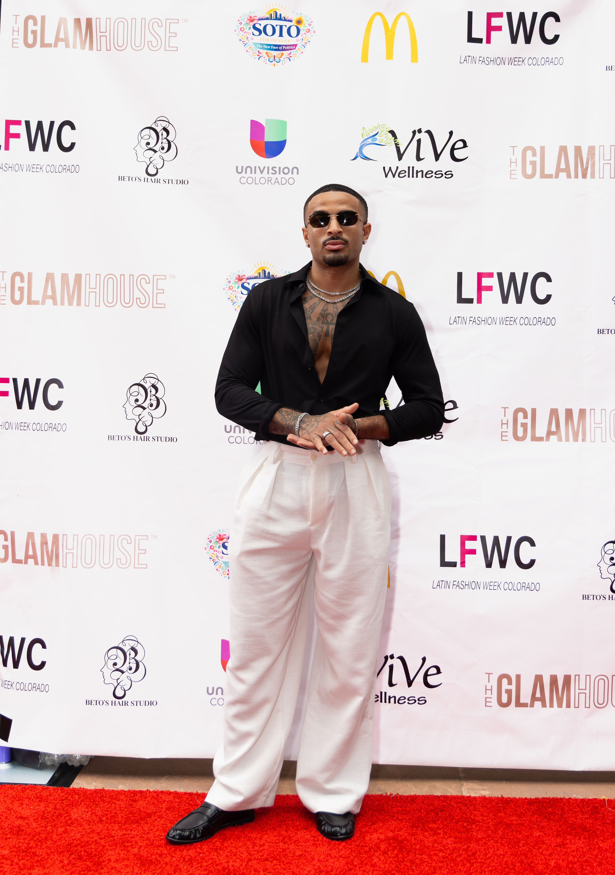 James Muhammad full-length Latin Fashion Week Colorado red carpet portrait