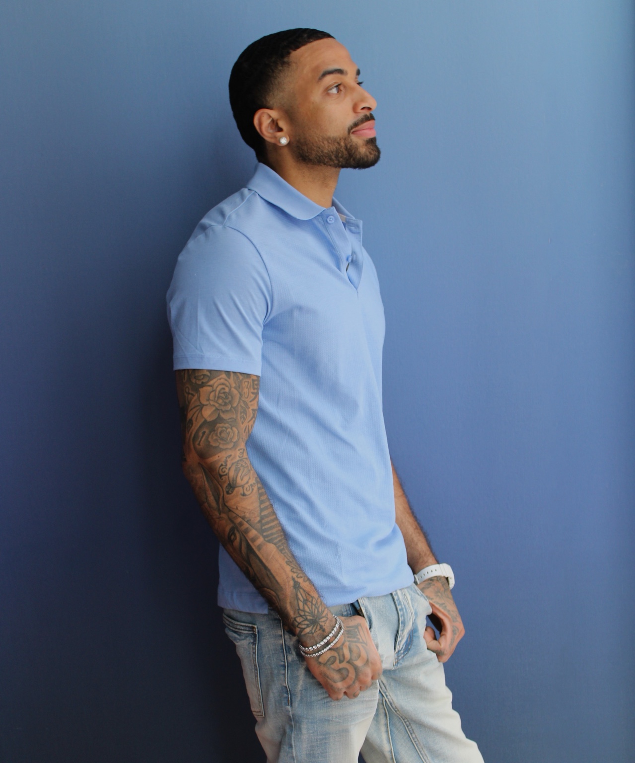 James Muhammad commercial portrait against a blue backdrop